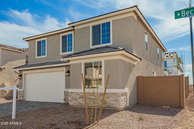 view of front of property with a garage