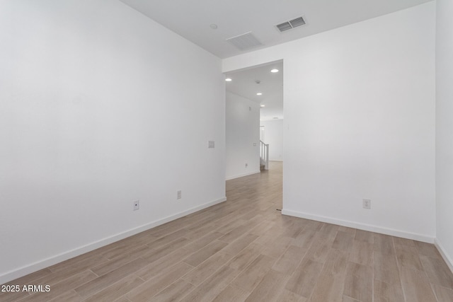 spare room featuring light wood-type flooring