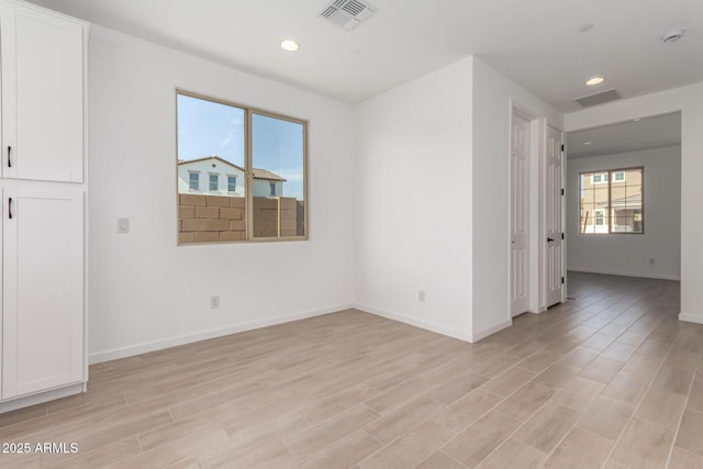 unfurnished room featuring light wood-type flooring