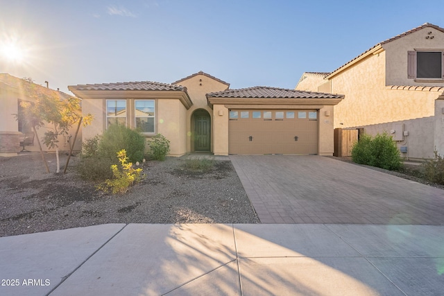 mediterranean / spanish-style home featuring a garage