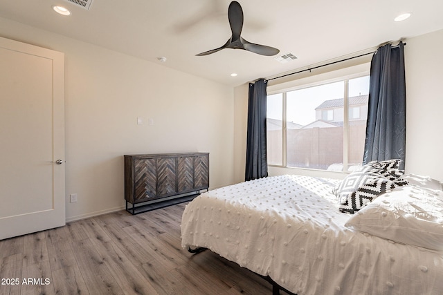 bedroom featuring light hardwood / wood-style flooring and ceiling fan