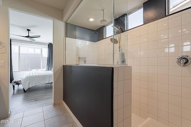 bathroom featuring tile patterned floors, ceiling fan, and a tile shower