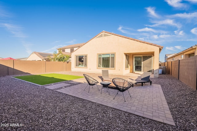 rear view of property with a patio area