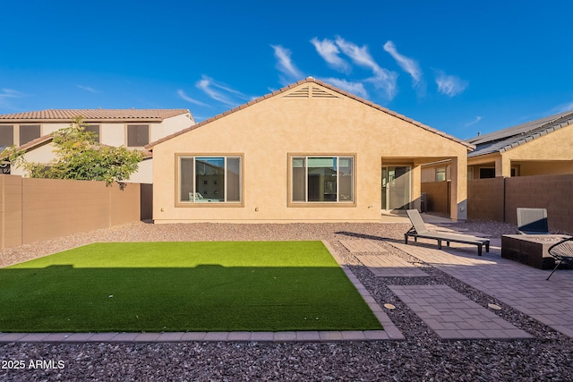 back of house featuring a patio area