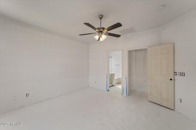 unfurnished bedroom featuring a ceiling fan, visible vents, and ensuite bath