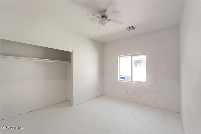 unfurnished bedroom featuring ceiling fan, visible vents, and a closet