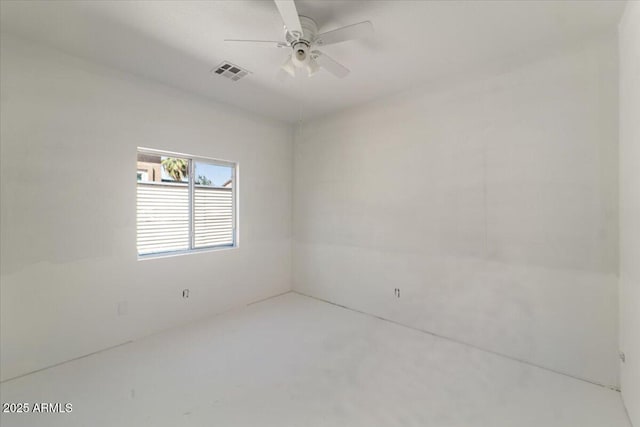 spare room with a ceiling fan and visible vents