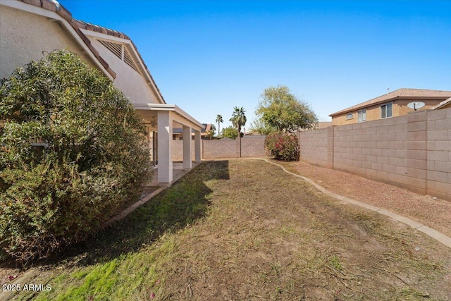 view of yard featuring a fenced backyard and a patio