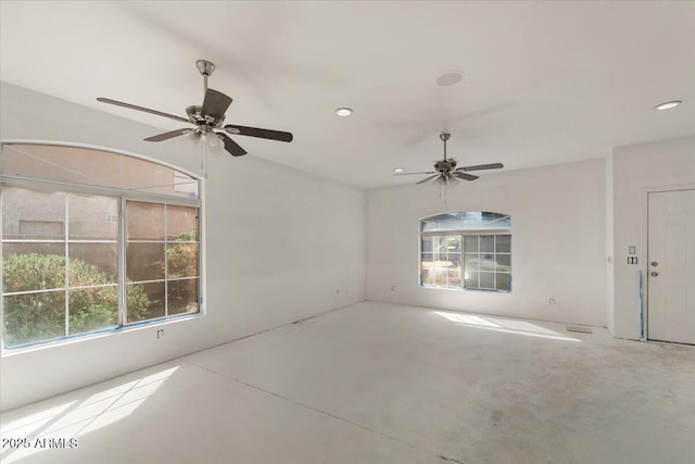 spare room featuring ceiling fan, concrete floors, and recessed lighting