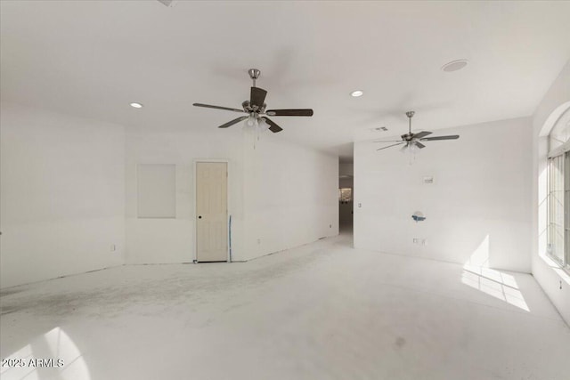 empty room featuring recessed lighting, concrete floors, and ceiling fan