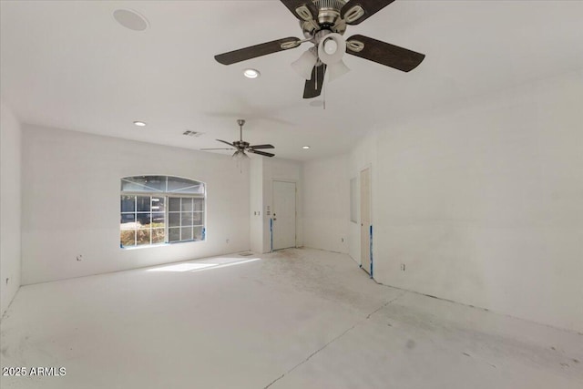 empty room featuring unfinished concrete floors, visible vents, and recessed lighting