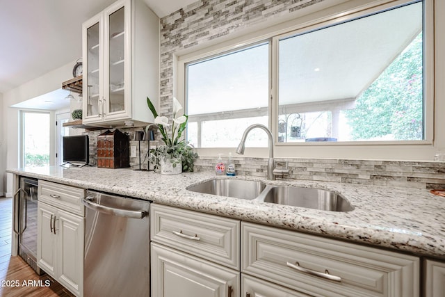 9085 E Windrose Dr, Scottsdale, AZ 85260 - kitchen with dishwasher, wine cooler, white cabinets, glass insert cabinets, and light stone countertops
