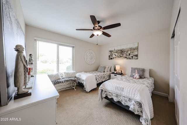 9085 E Windrose Dr, Scottsdale, AZ 85260 - bedroom featuring light carpet, ceiling fan, and a closet