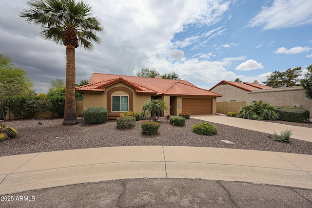 9085 E Windrose Dr, Scottsdale, AZ 85260 - mediterranean / spanish-style house featuring a tiled roof, stucco siding, driveway, and a garage