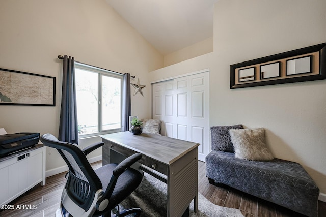 9085 E Windrose Dr, Scottsdale, AZ 85260 - home office with high vaulted ceiling and dark wood-type flooring
