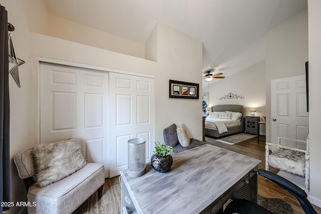 9085 E Windrose Dr, Scottsdale, AZ 85260 - bedroom featuring lofted ceiling, dark wood-style floors, a closet, and a ceiling fan
