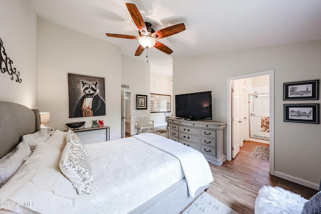9085 E Windrose Dr, Scottsdale, AZ 85260 - bedroom featuring wood finished floors, vaulted ceiling, and ceiling fan