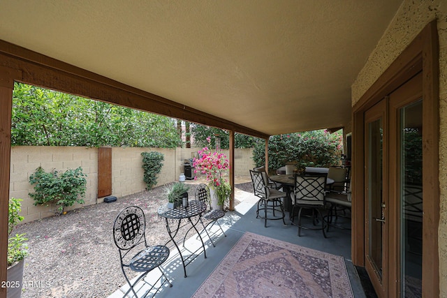 9085 E Windrose Dr, Scottsdale, AZ 85260 - fenced backyard with a patio and outdoor dining area