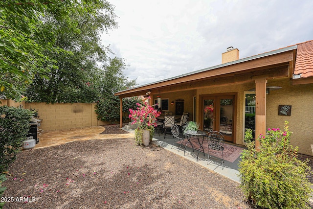 9085 E Windrose Dr, Scottsdale, AZ 85260 - view of yard featuring french doors and a patio