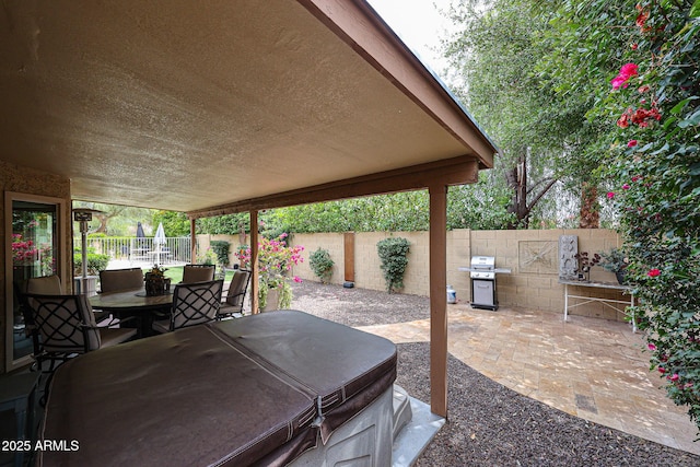 9085 E Windrose Dr, Scottsdale, AZ 85260 - fenced backyard with a patio, a hot tub, and grilling area
