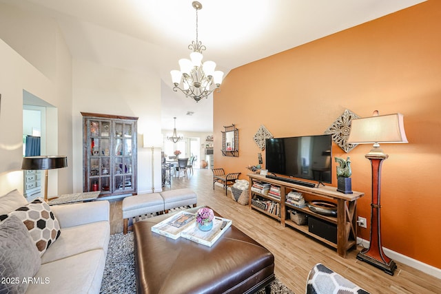 9085 E Windrose Dr, Scottsdale, AZ 85260 - living room with a chandelier and wood finished floors