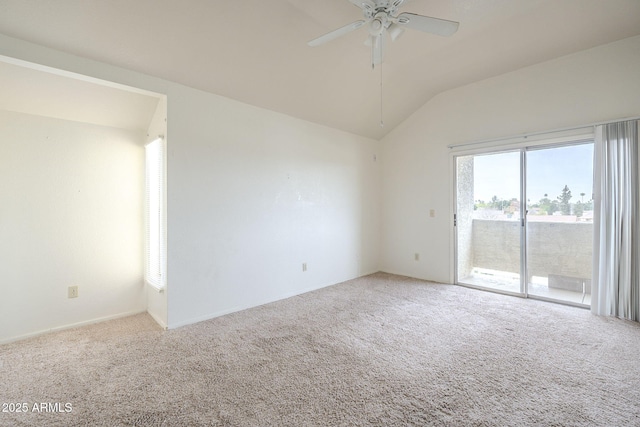 unfurnished room with lofted ceiling, ceiling fan, and carpet flooring