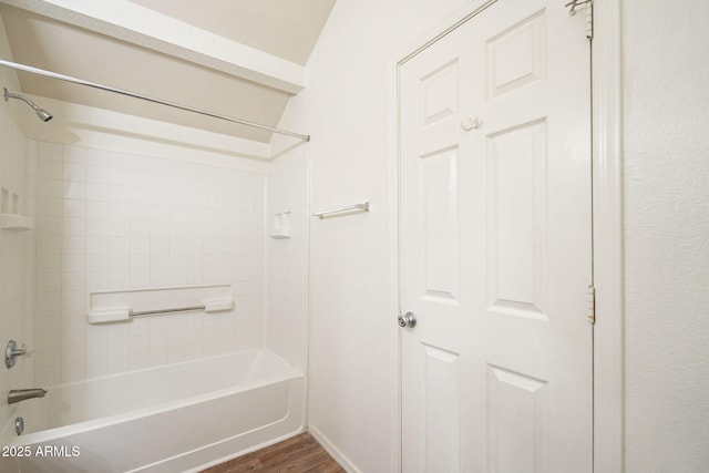 bathroom with bathing tub / shower combination and wood finished floors