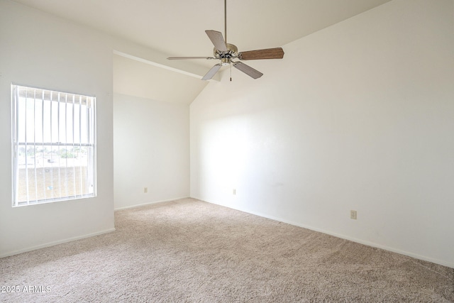 unfurnished room with ceiling fan, vaulted ceiling, and carpet flooring