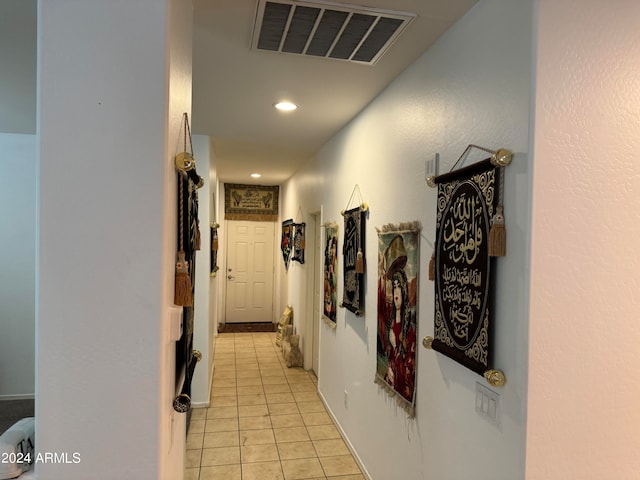 hallway with light tile floors