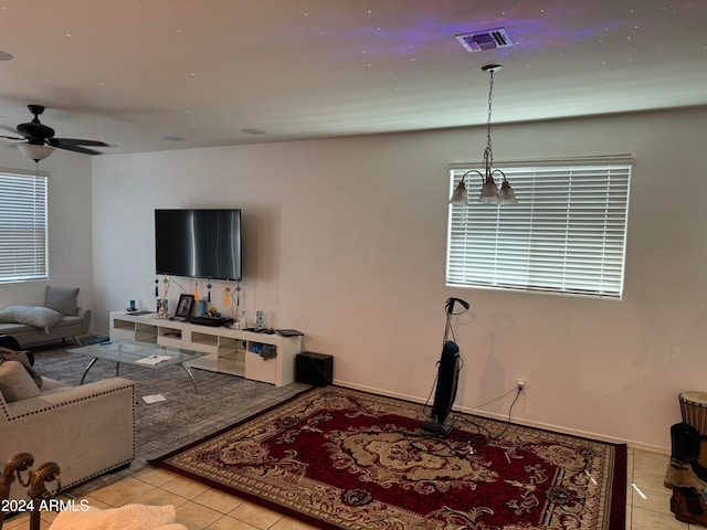 living room featuring ceiling fan and light tile flooring