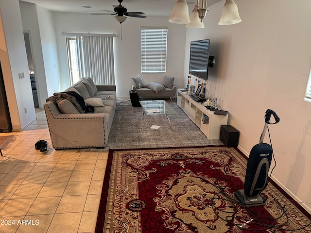 tiled living room with ceiling fan