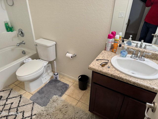 full bathroom featuring tub / shower combination, vanity, tile floors, and toilet