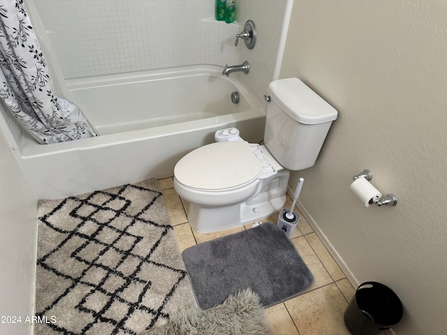 bathroom with shower / tub combo, toilet, and tile flooring