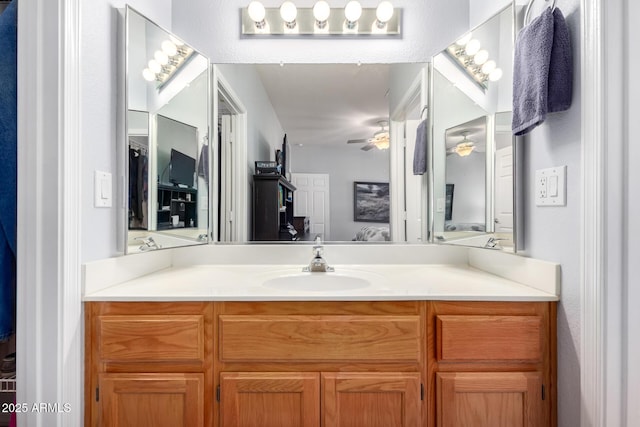 bathroom featuring vanity and ceiling fan