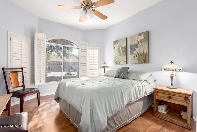 bedroom featuring hardwood / wood-style floors and ceiling fan