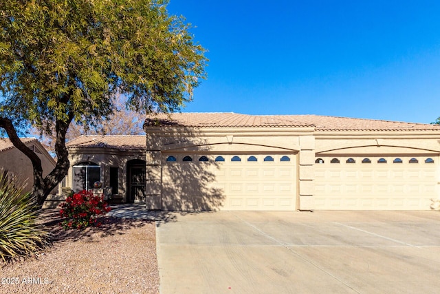 mediterranean / spanish-style house featuring a garage