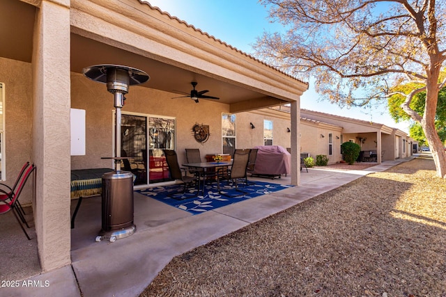 view of patio / terrace featuring ceiling fan and a grill