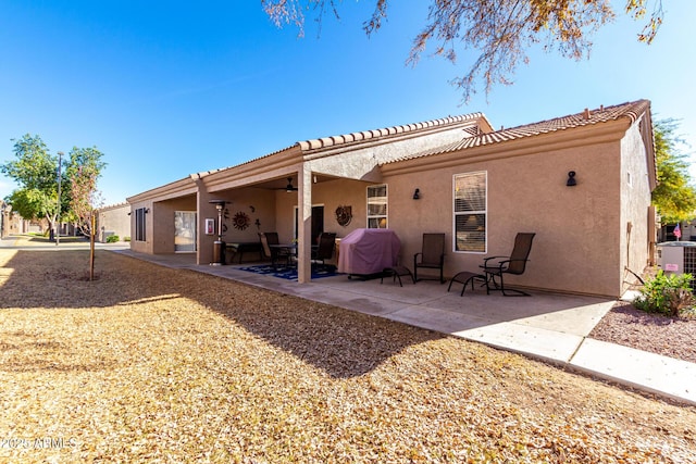 back of house with a patio and central AC unit