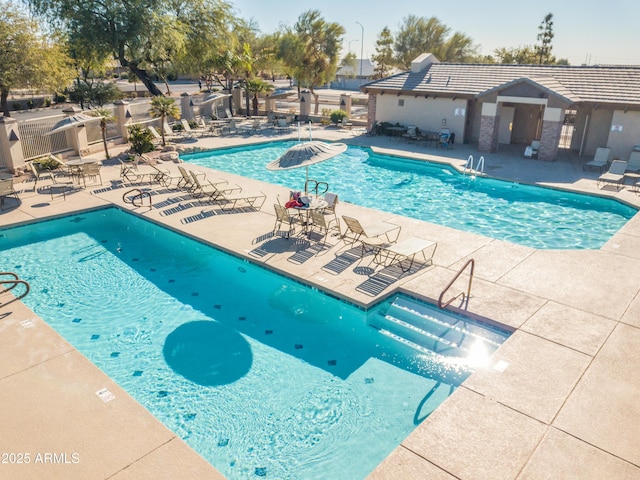 view of swimming pool with a patio