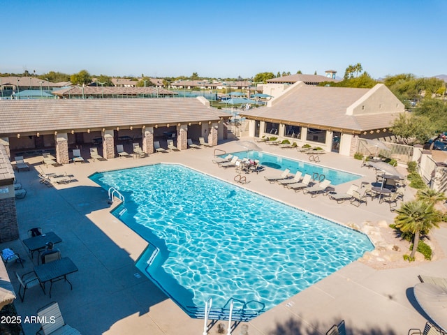 view of swimming pool featuring a patio area