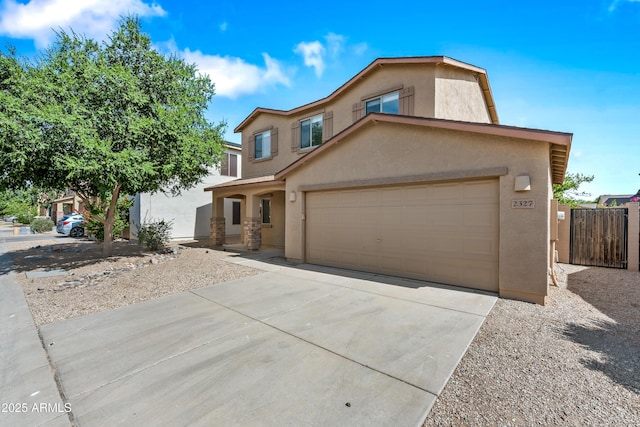 2327 E Meadow Creek Way, San Tan Valley, AZ 85140 - view of front facade with stucco siding, driveway, and an attached garage