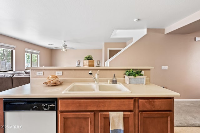 2327 E Meadow Creek Way, San Tan Valley, AZ 85140 - kitchen with dishwasher, a sink, open floor plan, light countertops, and brown cabinetry