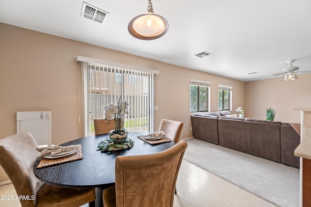 2327 E Meadow Creek Way, San Tan Valley, AZ 85140 - carpeted dining area featuring a ceiling fan and tile patterned floors