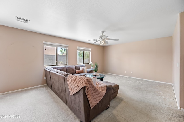 2327 E Meadow Creek Way, San Tan Valley, AZ 85140 - living area featuring light colored carpet, ceiling fan, and baseboards