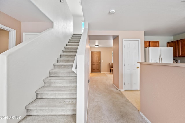 2327 E Meadow Creek Way, San Tan Valley, AZ 85140 - staircase featuring carpet flooring and baseboards
