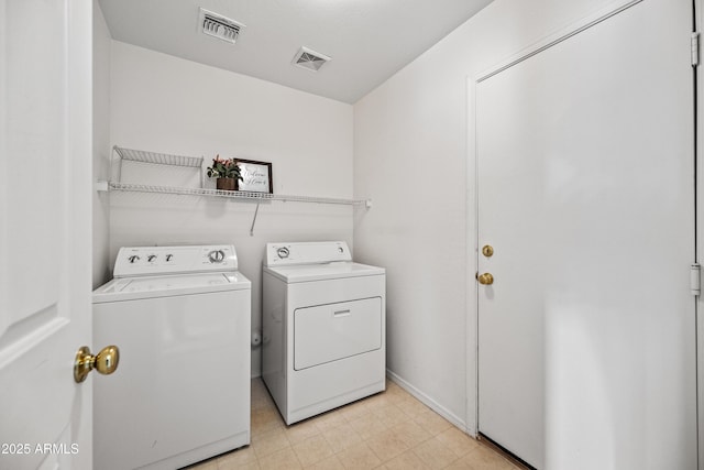 2327 E Meadow Creek Way, San Tan Valley, AZ 85140 - laundry room featuring washing machine and clothes dryer and baseboards