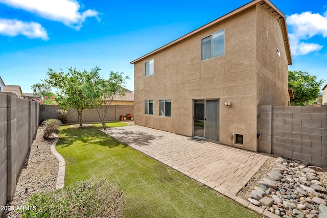 2327 E Meadow Creek Way, San Tan Valley, AZ 85140 - rear view of house with stucco siding and a patio