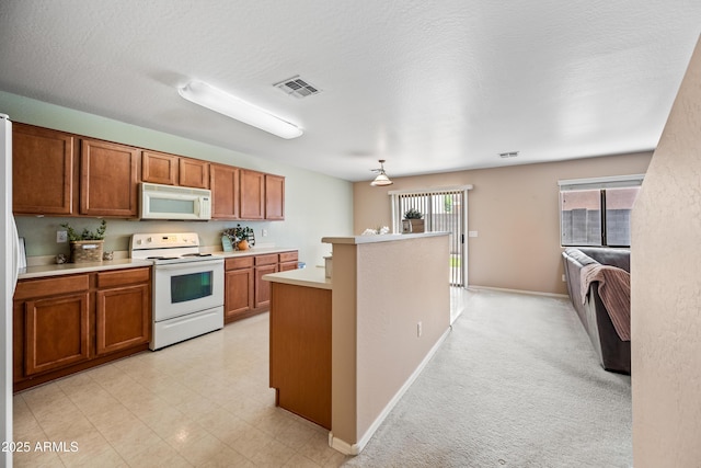 2327 E Meadow Creek Way, San Tan Valley, AZ 85140 - kitchen featuring white appliances, brown cabinetry, light countertops, baseboards, and a kitchen island