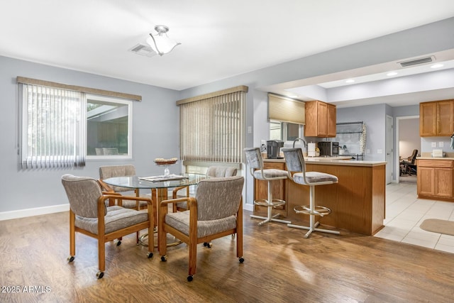 dining room featuring light wood-type flooring