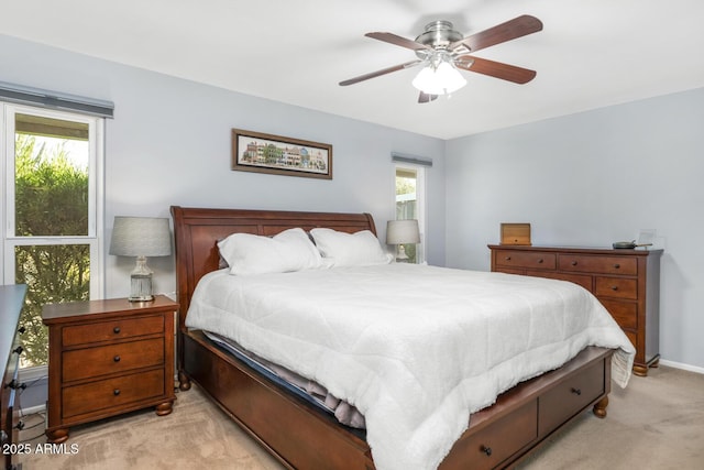 bedroom featuring ceiling fan and light colored carpet